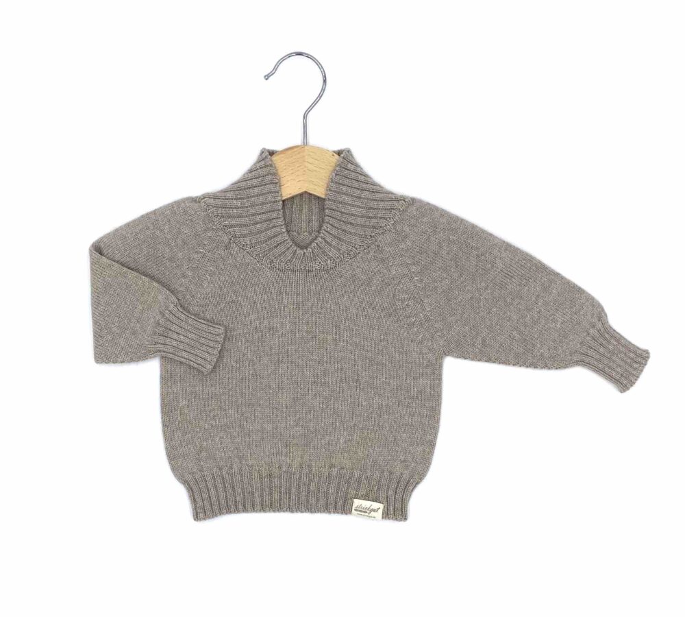 Weicher Babypullover mit dehnbarem Halsausschnitt aus Merinowolle für Neugeborene ab der Geburt.